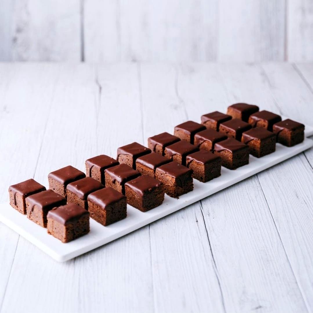 KKD brownies cut into squares and finished with a chocolate drizzle